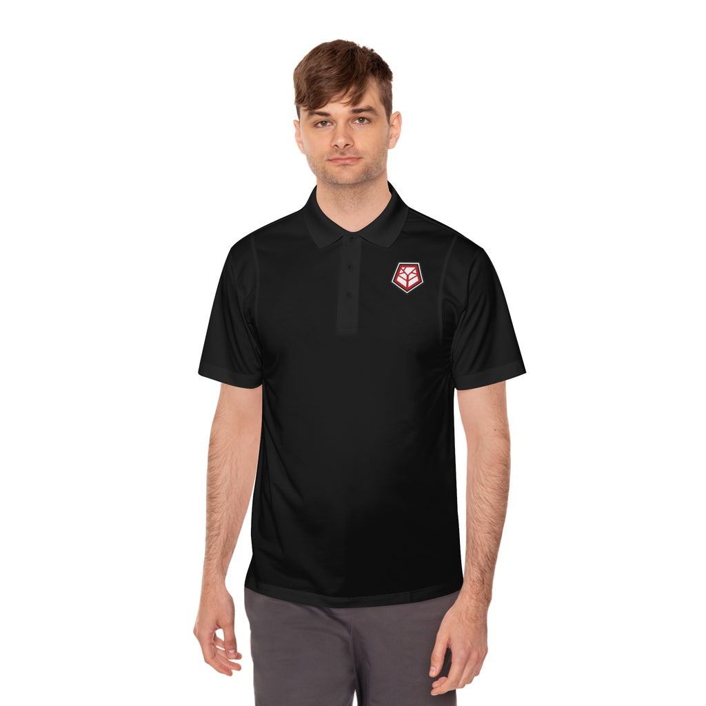 Person wearing black polo shirt with Refuge tree of life logo on left chest